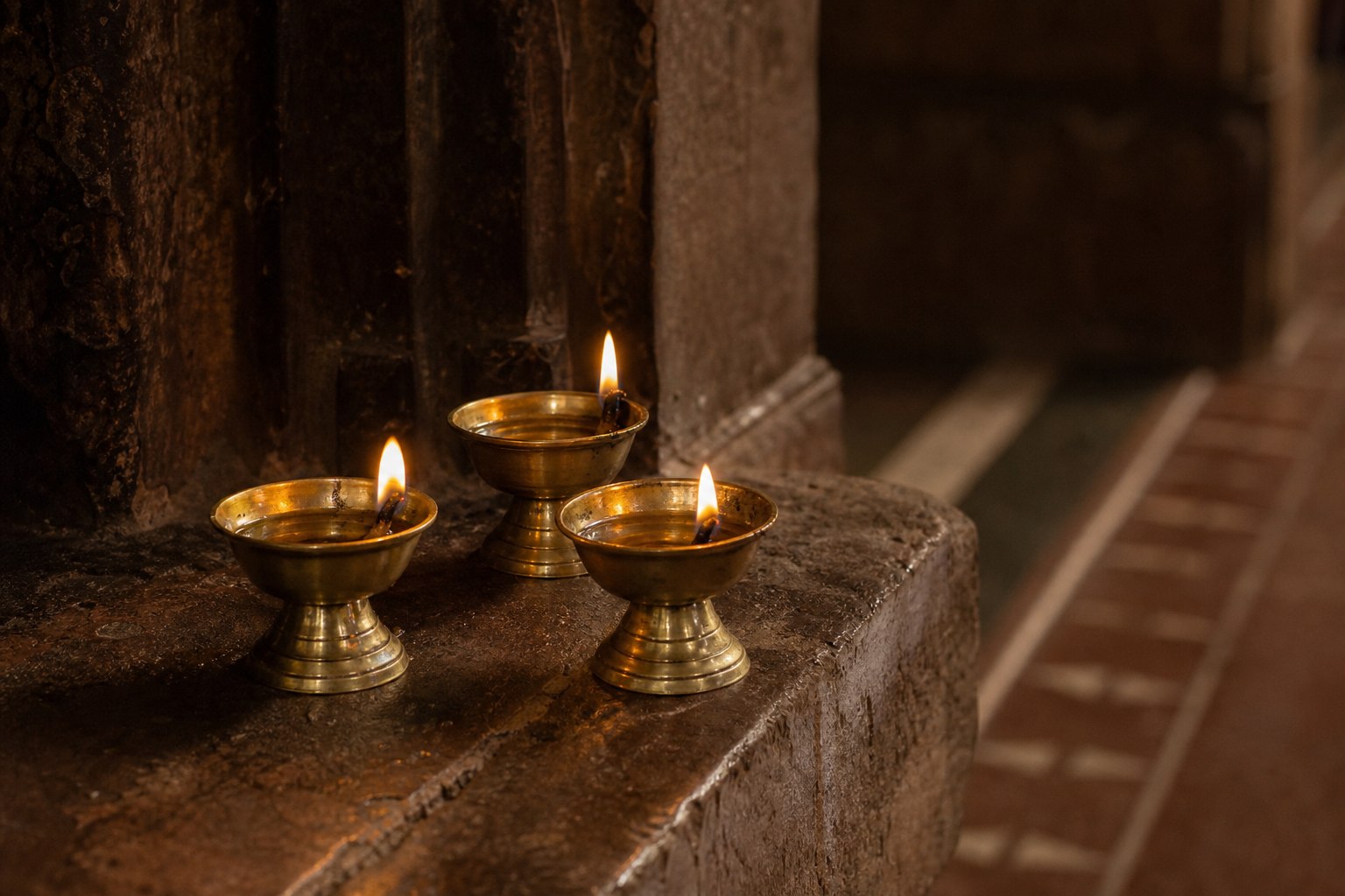 Brass oil lamps prepared for a devotional ceremony