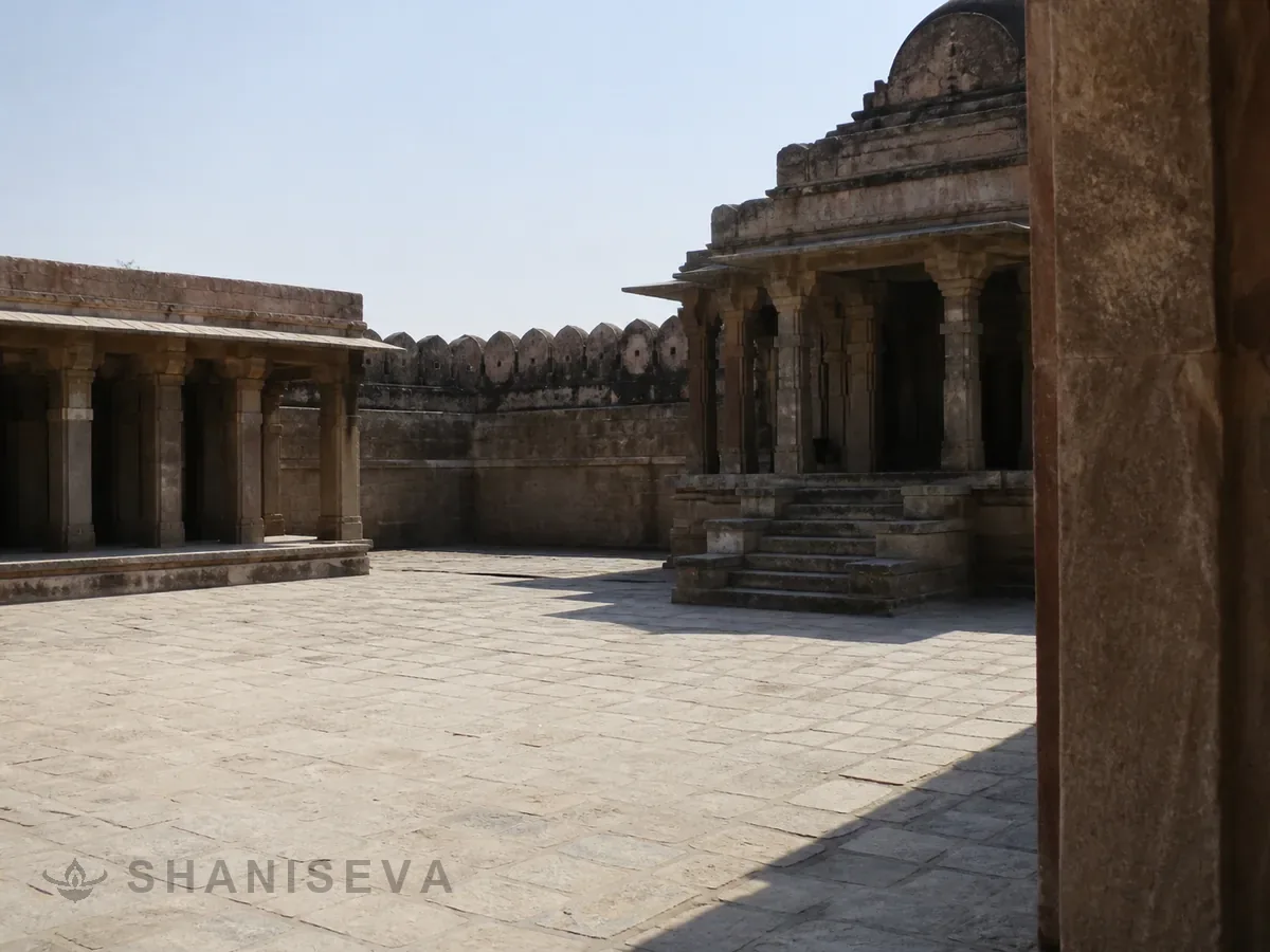 An empty stone courtyard at noon